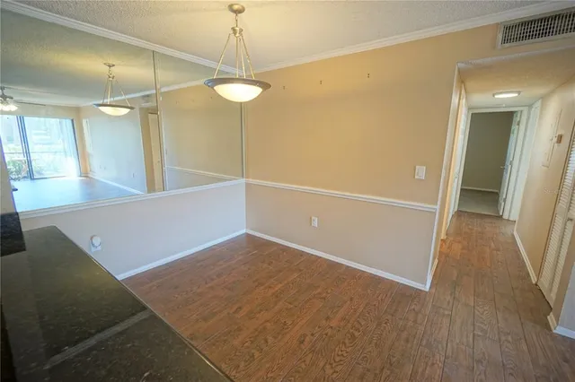 a view of a hallway with an empty room