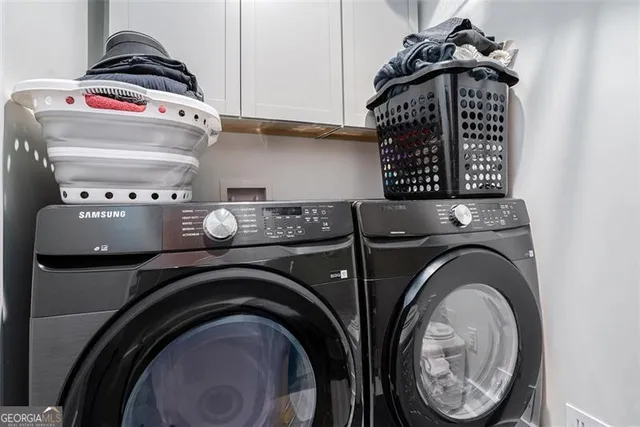 a utility room with dryer and washer