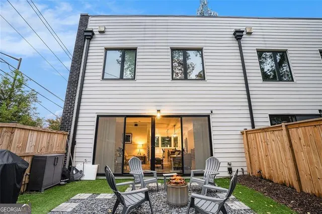 a view of a patio with chairs and table in a patio