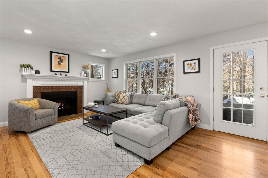 145 River Street Middleton, MA 01949 - Photo 14 of 42 a living room with furniture and a fireplace