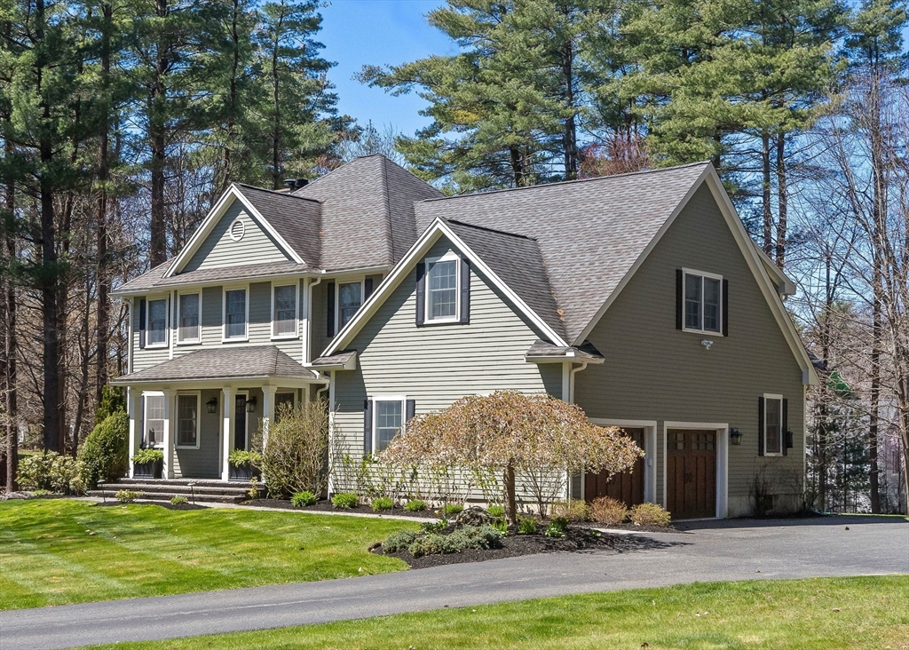 145 River Street Middleton, MA 01949 - Photo 2 of 42 a front view of a house with a yard