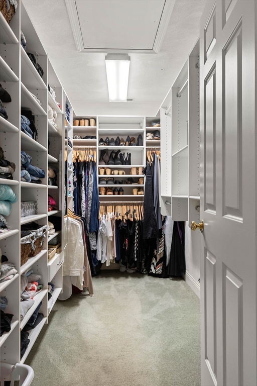 145 River Street Middleton, MA 01949 - Photo 21 of 42 a view of walk in closet with clothes and shoes
