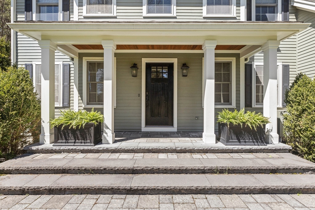 145 River Street Middleton, MA 01949 - Photo 3 of 42 front view of a house and a bench