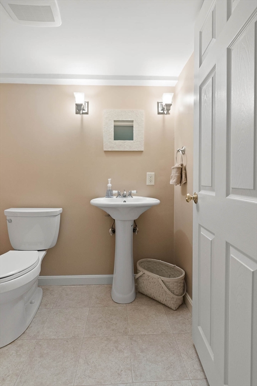 145 River Street Middleton, MA 01949 - Photo 33 of 42 a bathroom with a sink toilet and a mirror