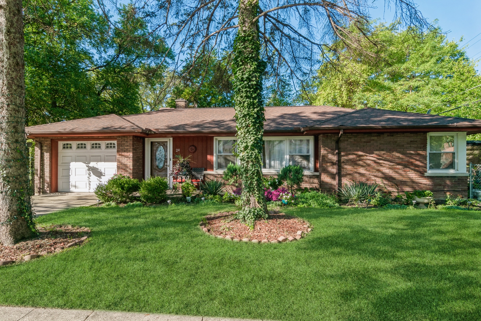 24 North Delaplaine Road Riverside, IL 60546 - Photo 1 of 11 a front view of a house with a garden