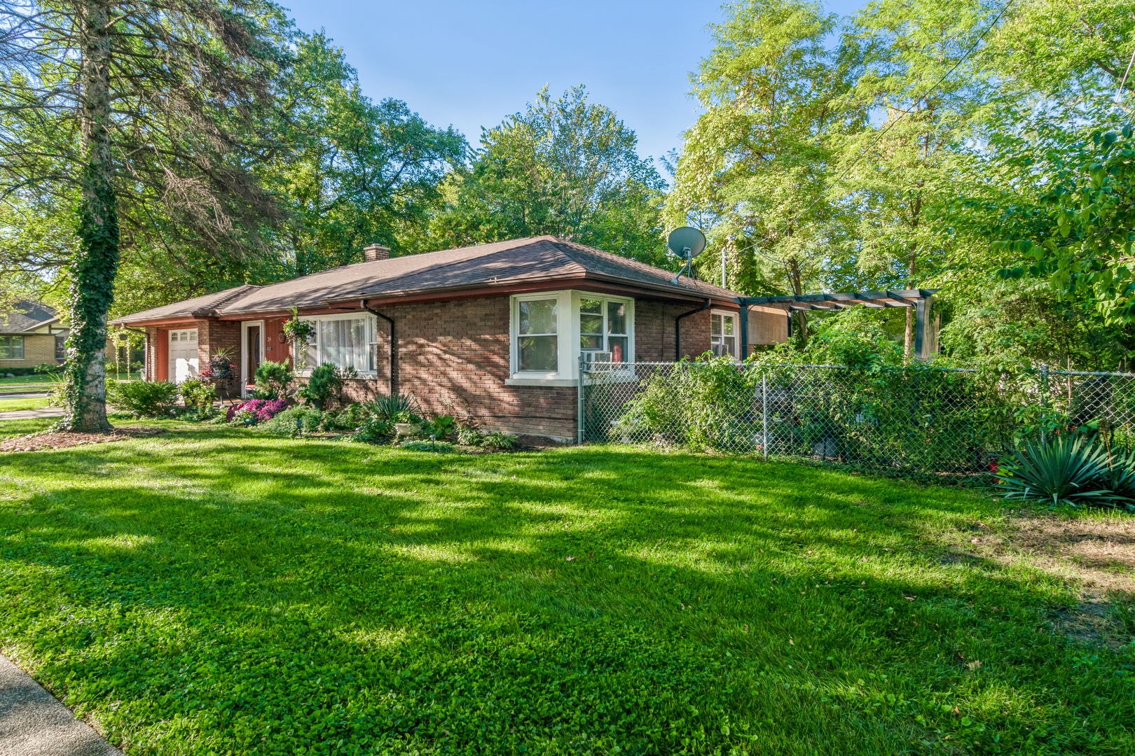 24 North Delaplaine Road Riverside, IL 60546 - Photo 11 of 11 a front view of house with yard and green space