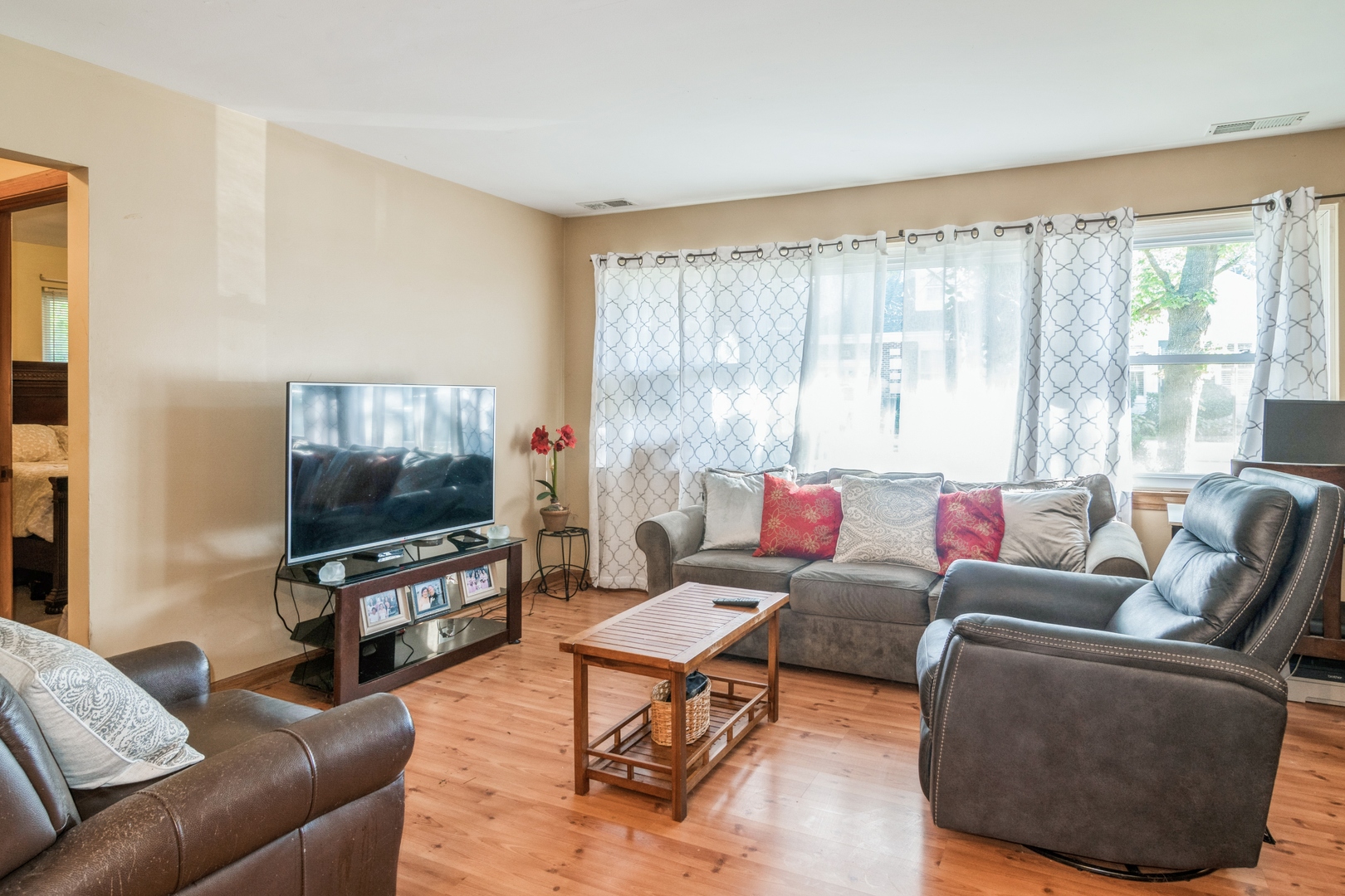 24 North Delaplaine Road Riverside, IL 60546 - Photo 2 of 11 a living room with furniture and a flat screen tv
