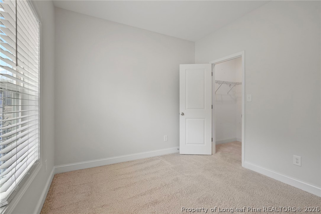 5150 J T Matthews Road Godwin, NC 28344 - Photo 11 of 50 an empty room with windows