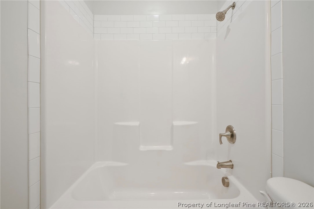 5150 J T Matthews Road Godwin, NC 28344 - Photo 14 of 50 a bathroom with a bathtub