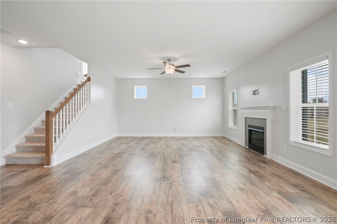 5150 J T Matthews Road Godwin, NC 28344 - Photo 16 of 50 wooden floor in an empty room with a fireplace