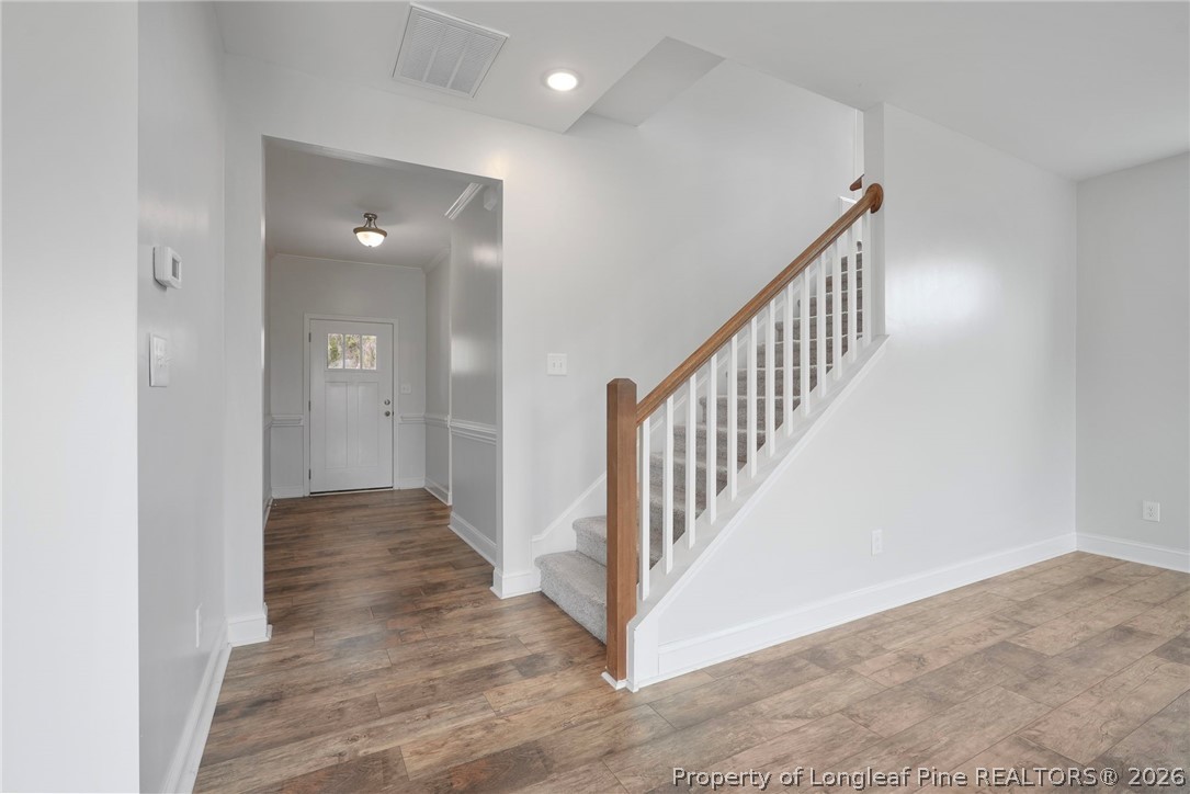 5150 J T Matthews Road Godwin, NC 28344 - Photo 25 of 50 a view of a hallway with wooden floor and entryway