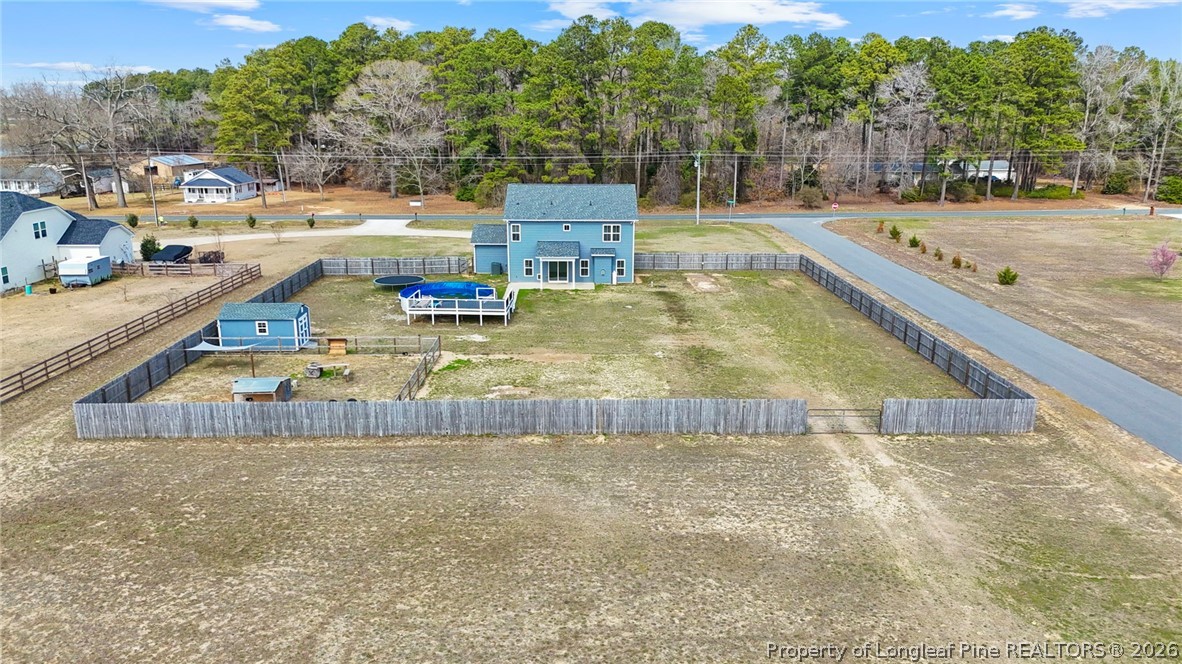 5150 J T Matthews Road Godwin, NC 28344 - Photo 3 of 50 a view of a swimming pool with a patio