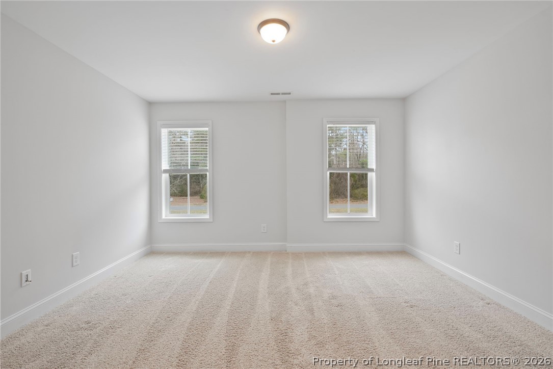 5150 J T Matthews Road Godwin, NC 28344 - Photo 31 of 50 an empty room with windows