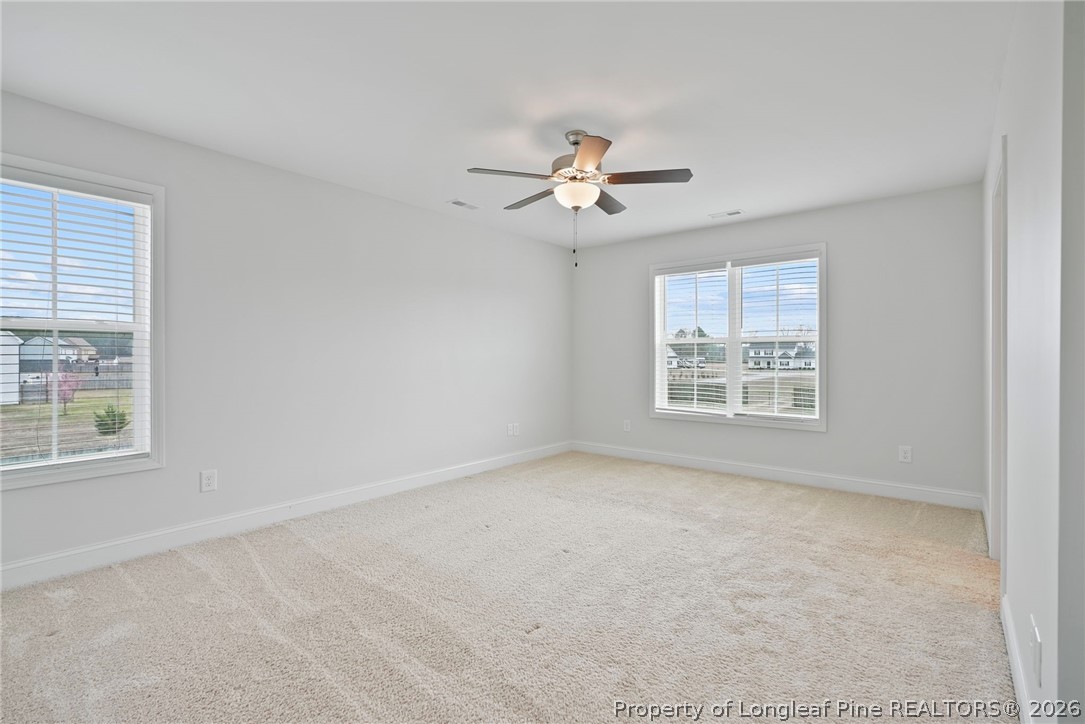 5150 J T Matthews Road Godwin, NC 28344 - Photo 40 of 50 an empty room with windows and fan