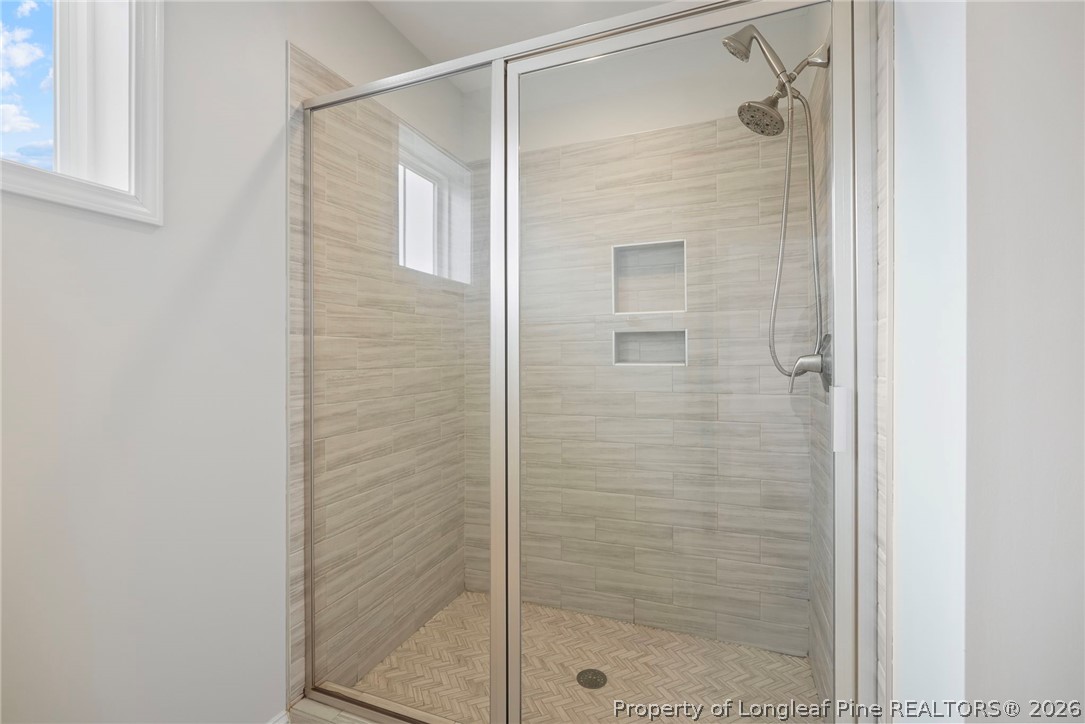 5150 J T Matthews Road Godwin, NC 28344 - Photo 43 of 50 a bathroom with a shower