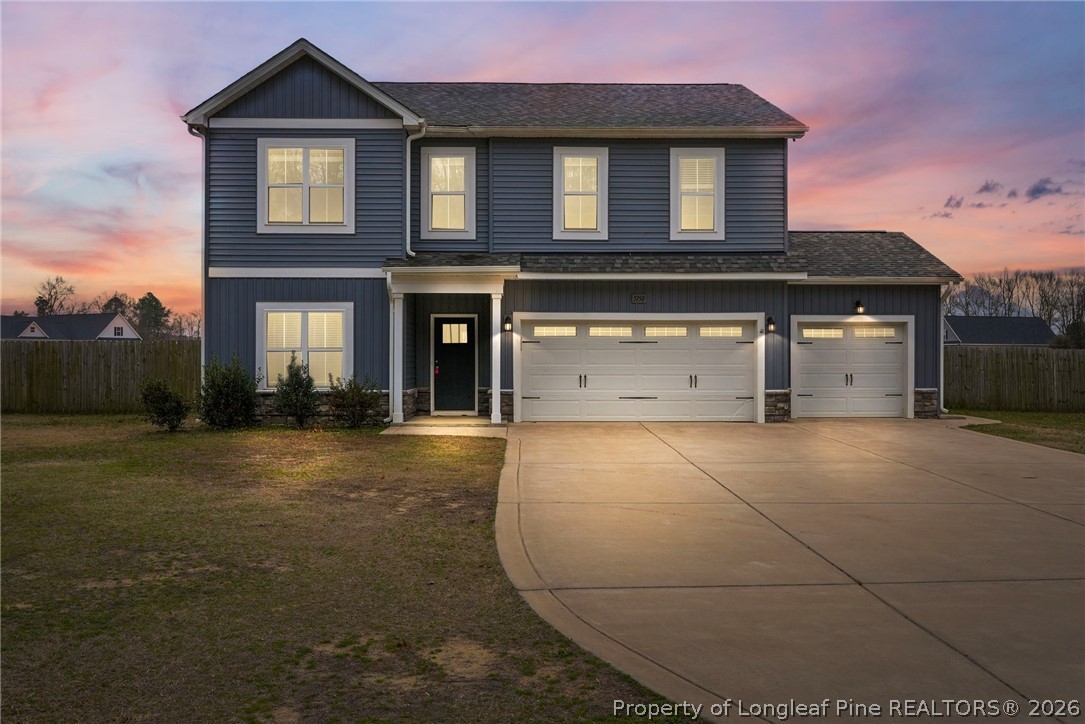 5150 J T Matthews Road Godwin, NC 28344 - Photo 49 of 50 a front view of a house with a garage