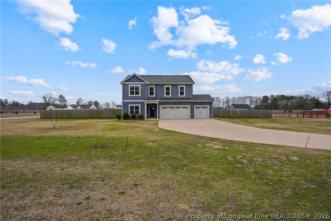 5150 J T Matthews Road Godwin, NC 28344 - Photo 5 of 50 a view of a house with a yard