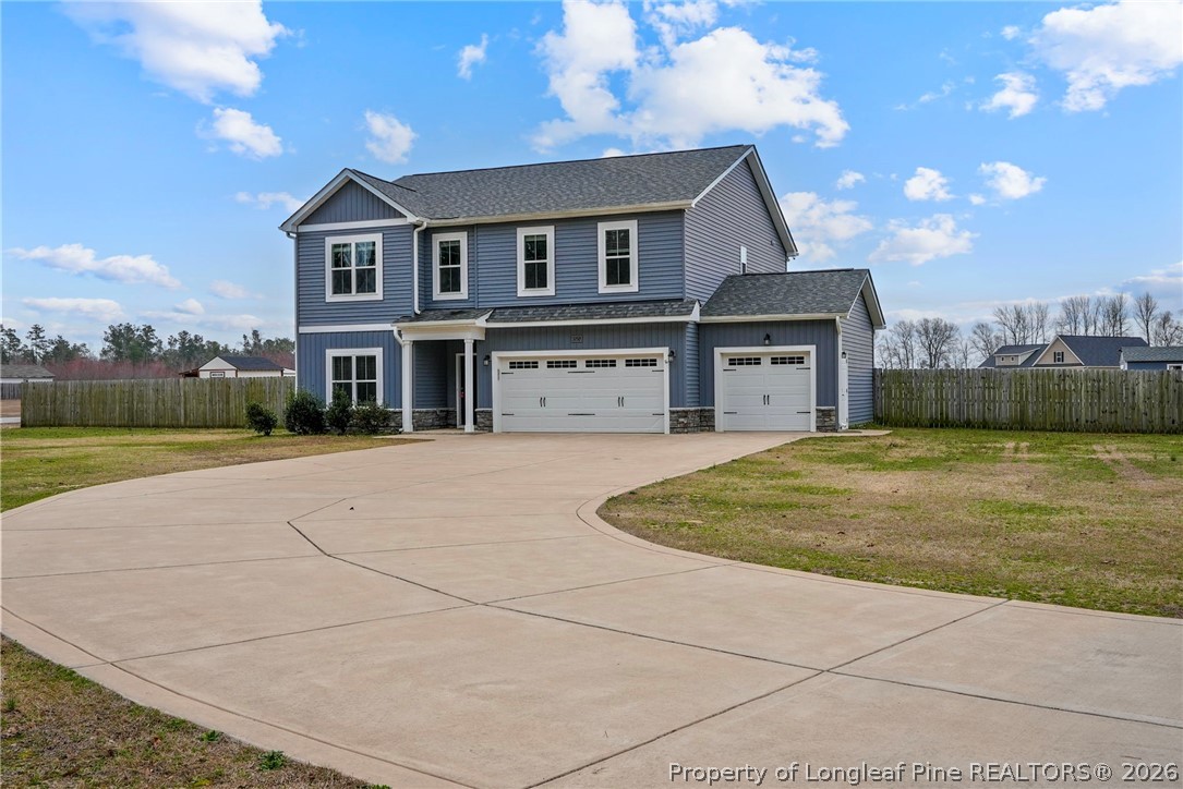 5150 J T Matthews Road Godwin, NC 28344 - Photo 6 of 50 a front view of a house with a yard