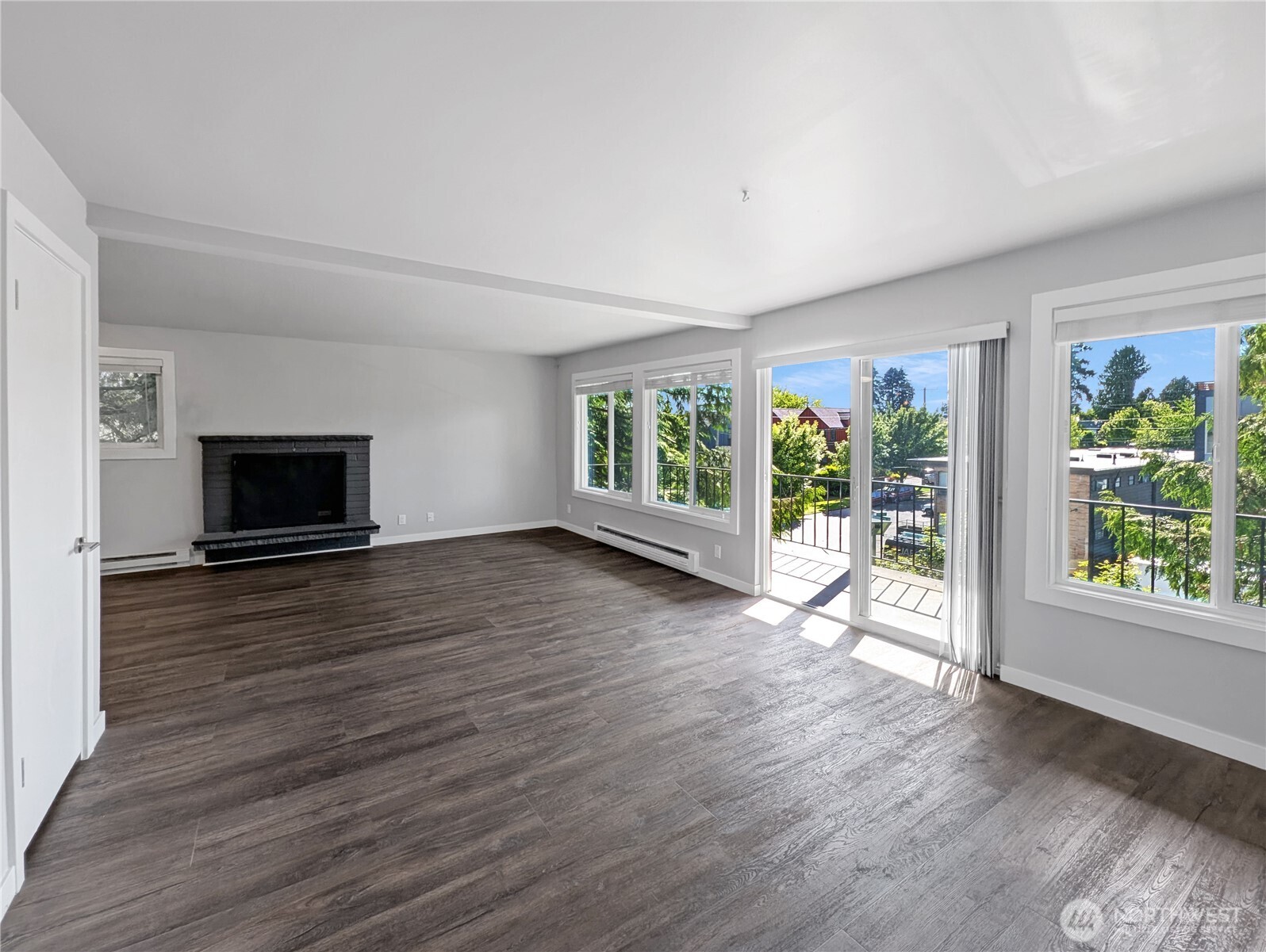 5954 Fauntleroy Way Southwest Seattle, WA 98136 - Photo 17 of 17 an empty room with wooden floor and windows
