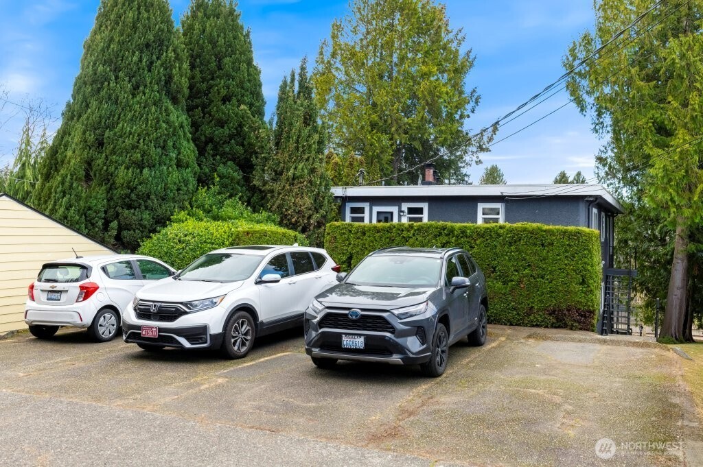 5954 Fauntleroy Way Southwest Seattle, WA 98136 - Photo 4 of 17 a view of a car parked in front of a house