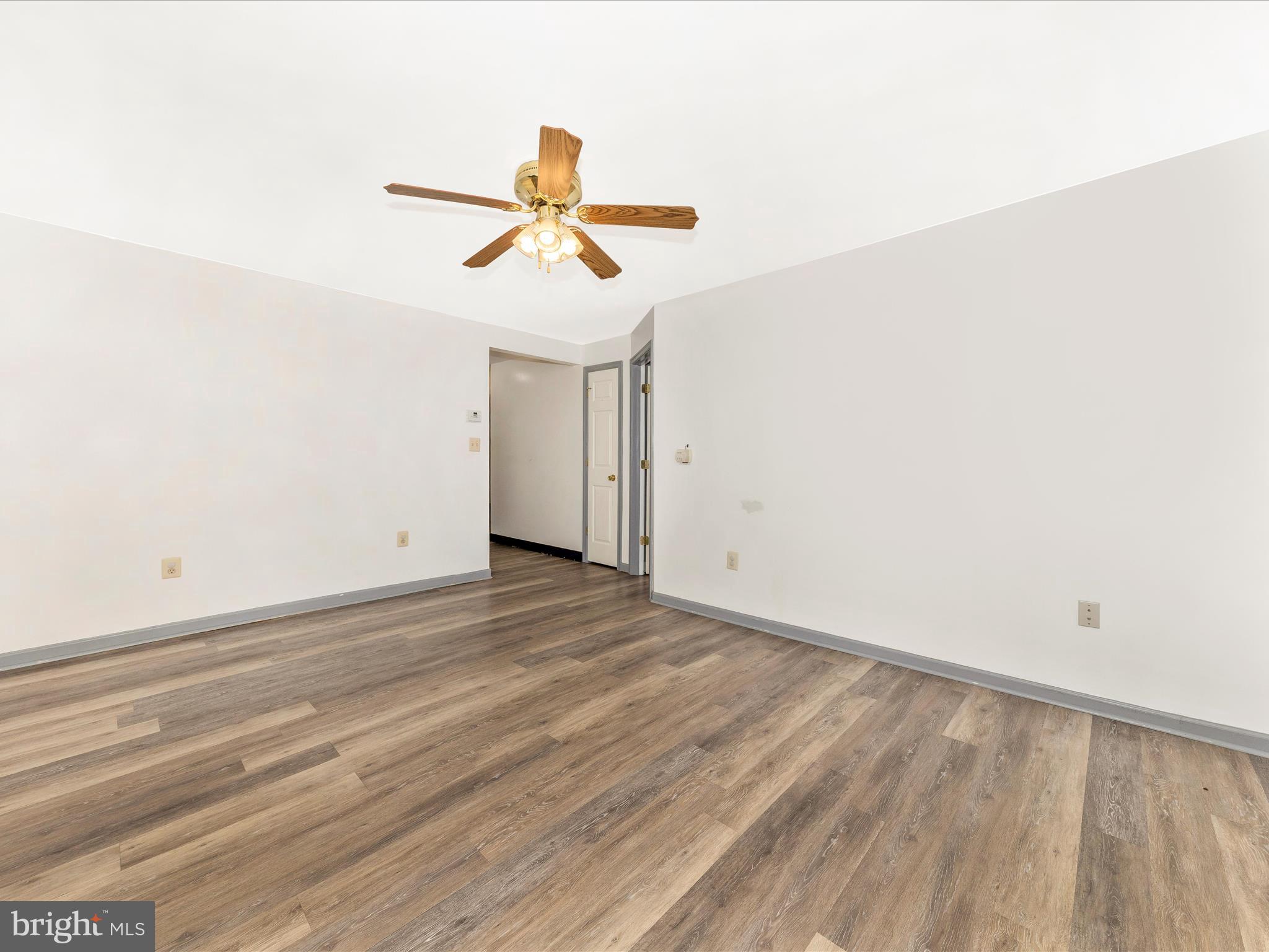 9320 Rocky Ridge Road Rocky Ridge, MD 21778 - Photo 11 of 54 a view of a room with wooden floor and white walls