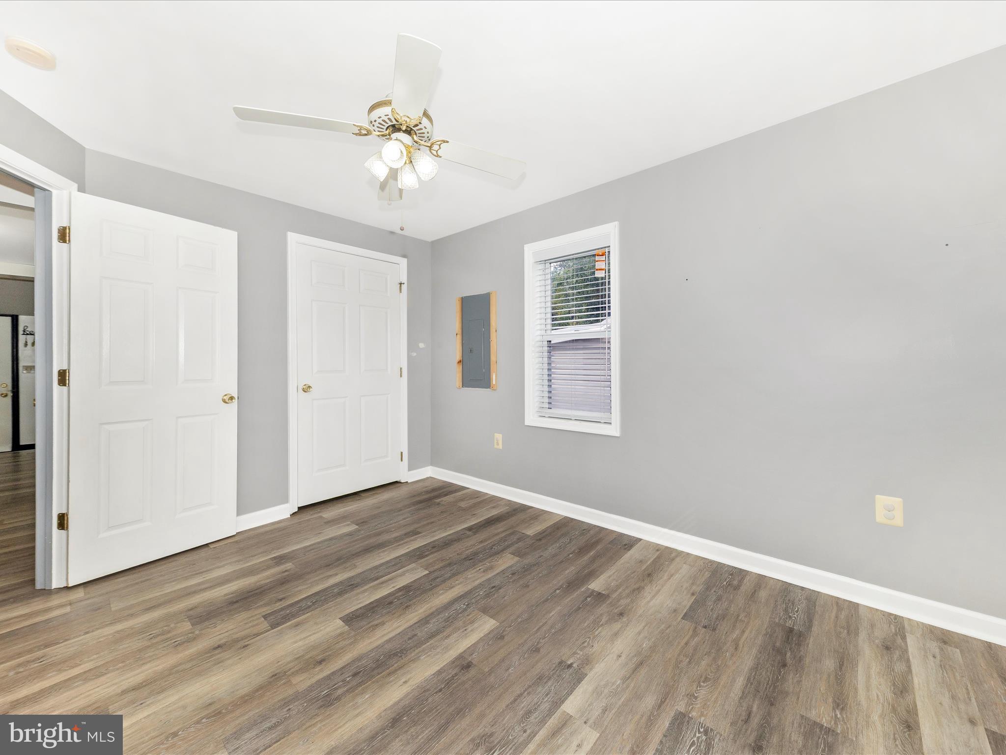 9320 Rocky Ridge Road Rocky Ridge, MD 21778 - Photo 16 of 54 a view of an empty room with wooden floor