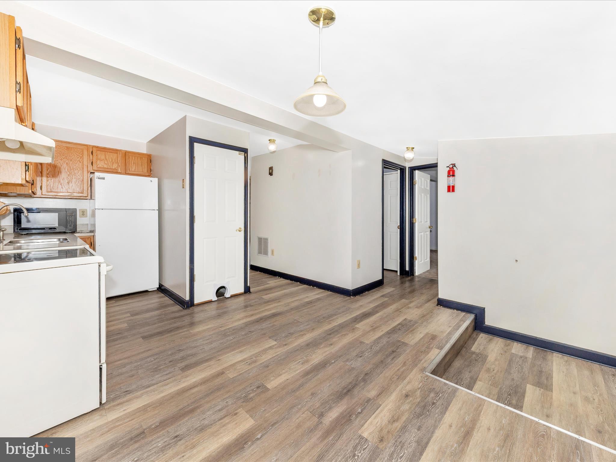 9320 Rocky Ridge Road Rocky Ridge, MD 21778 - Photo 22 of 54 a view of empty room with wooden floor and fan