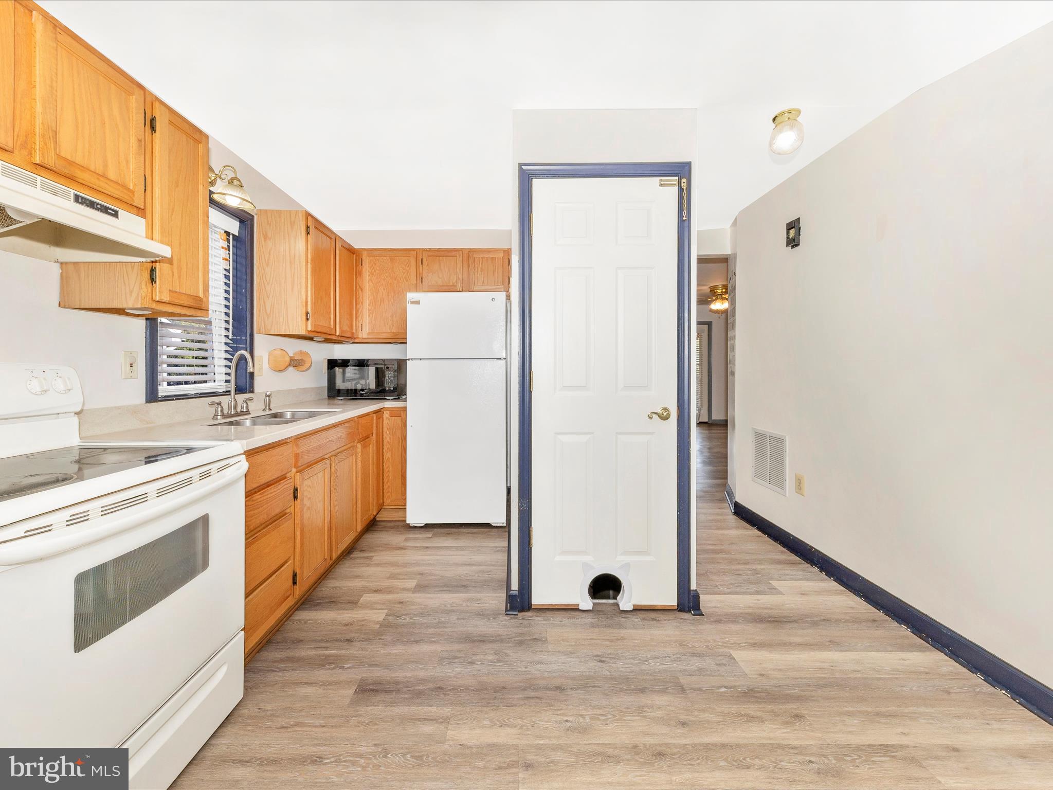 9320 Rocky Ridge Road Rocky Ridge, MD 21778 - Photo 25 of 54 a kitchen with stainless steel appliances a stove top oven and a refrigerator