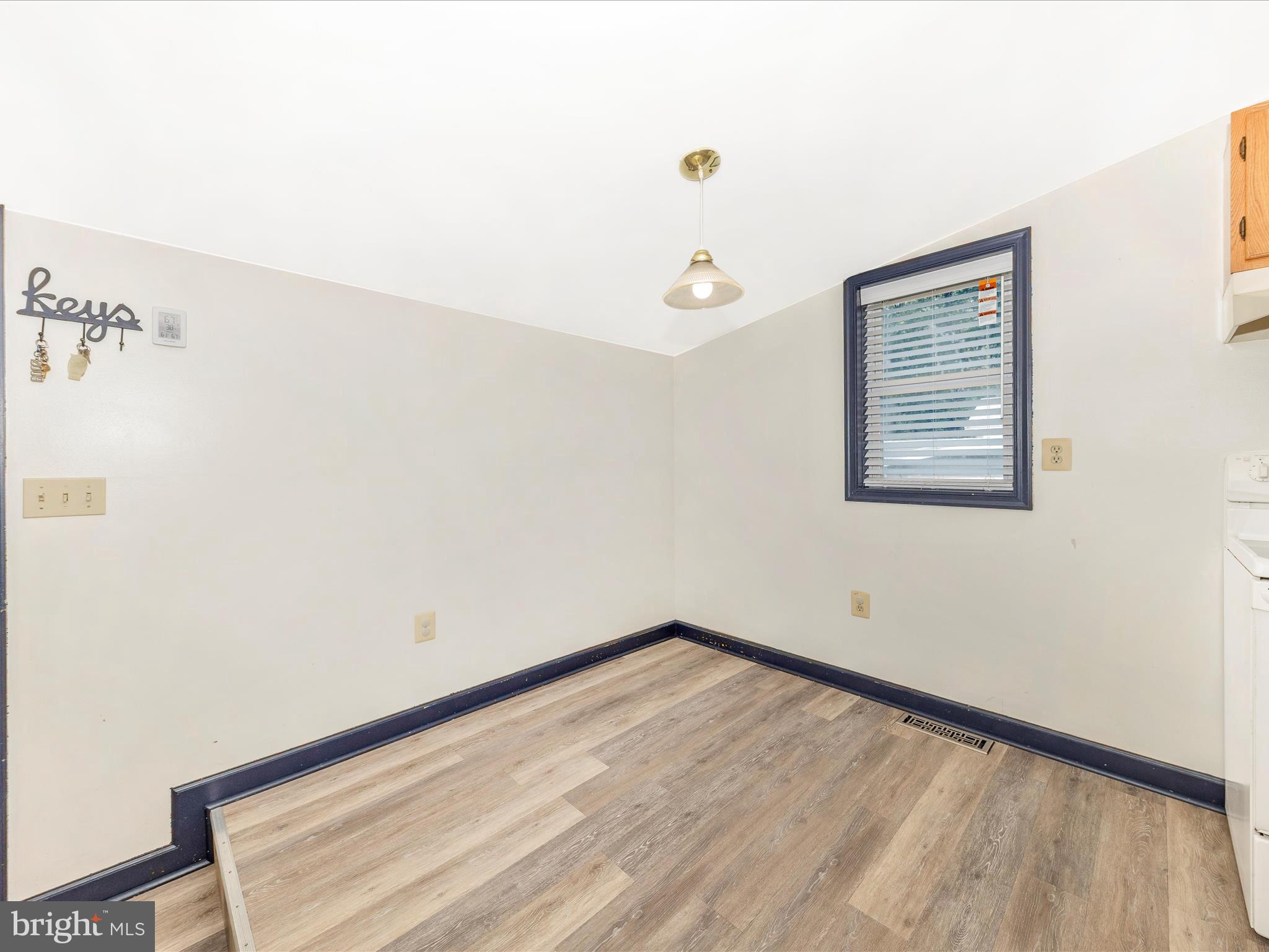 9320 Rocky Ridge Road Rocky Ridge, MD 21778 - Photo 27 of 54 a view of a room with wooden floor and a window