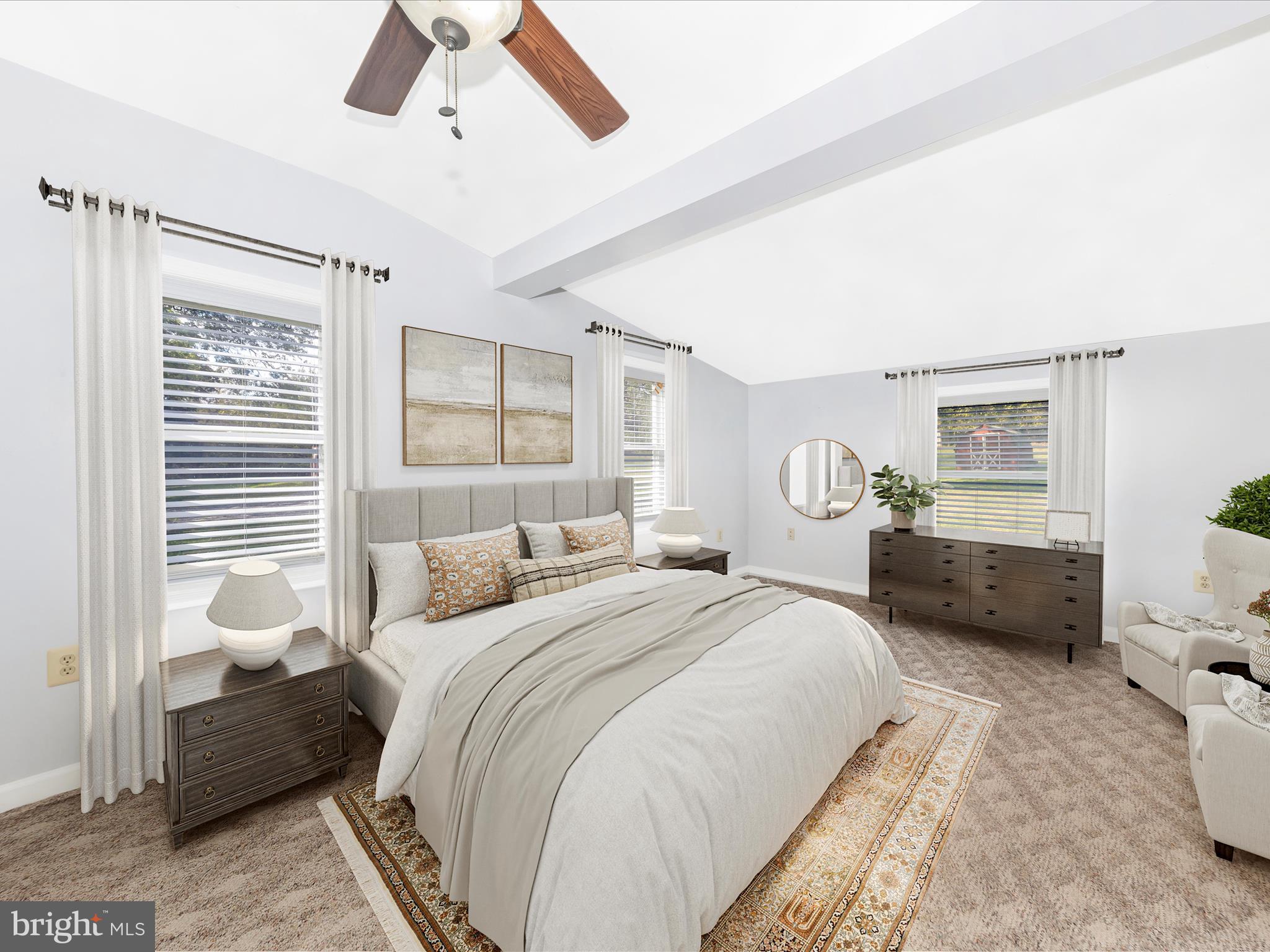 9320 Rocky Ridge Road Rocky Ridge, MD 21778 - Photo 28 of 54 a spacious bedroom with a bed a couch and a dresser