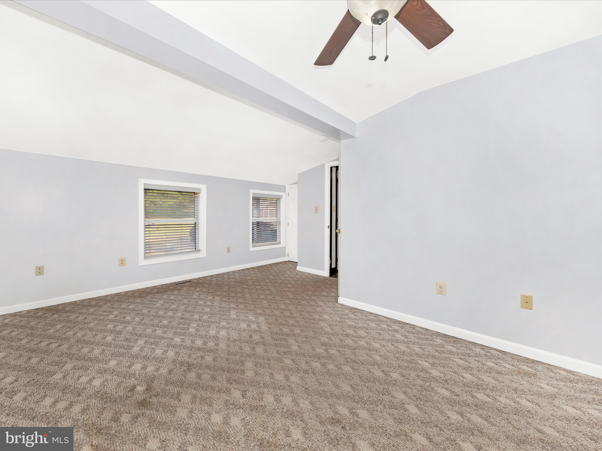 9320 Rocky Ridge Road Rocky Ridge, MD 21778 - Photo 32 of 54 an empty room with a ceiling fan and window