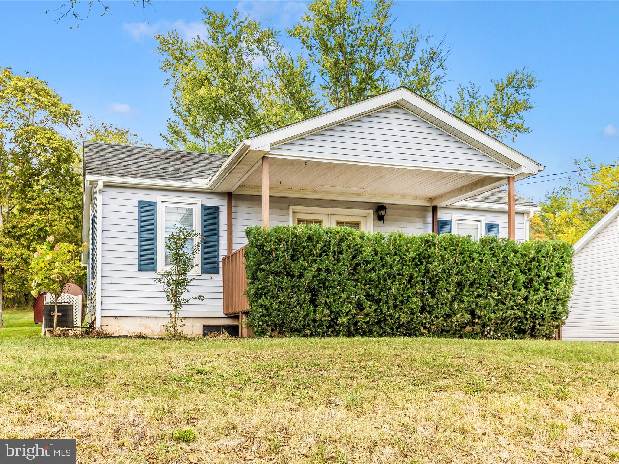 9320 Rocky Ridge Road Rocky Ridge, MD 21778 - Photo 42 of 54 a front view of a house with a garden
