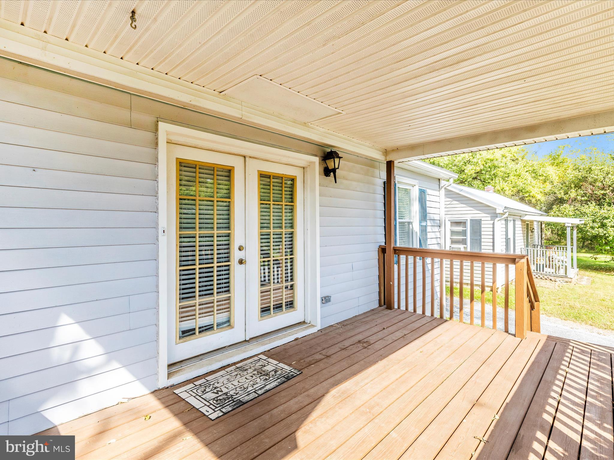9320 Rocky Ridge Road Rocky Ridge, MD 21778 - Photo 47 of 54 a view of a porch with wooden floor