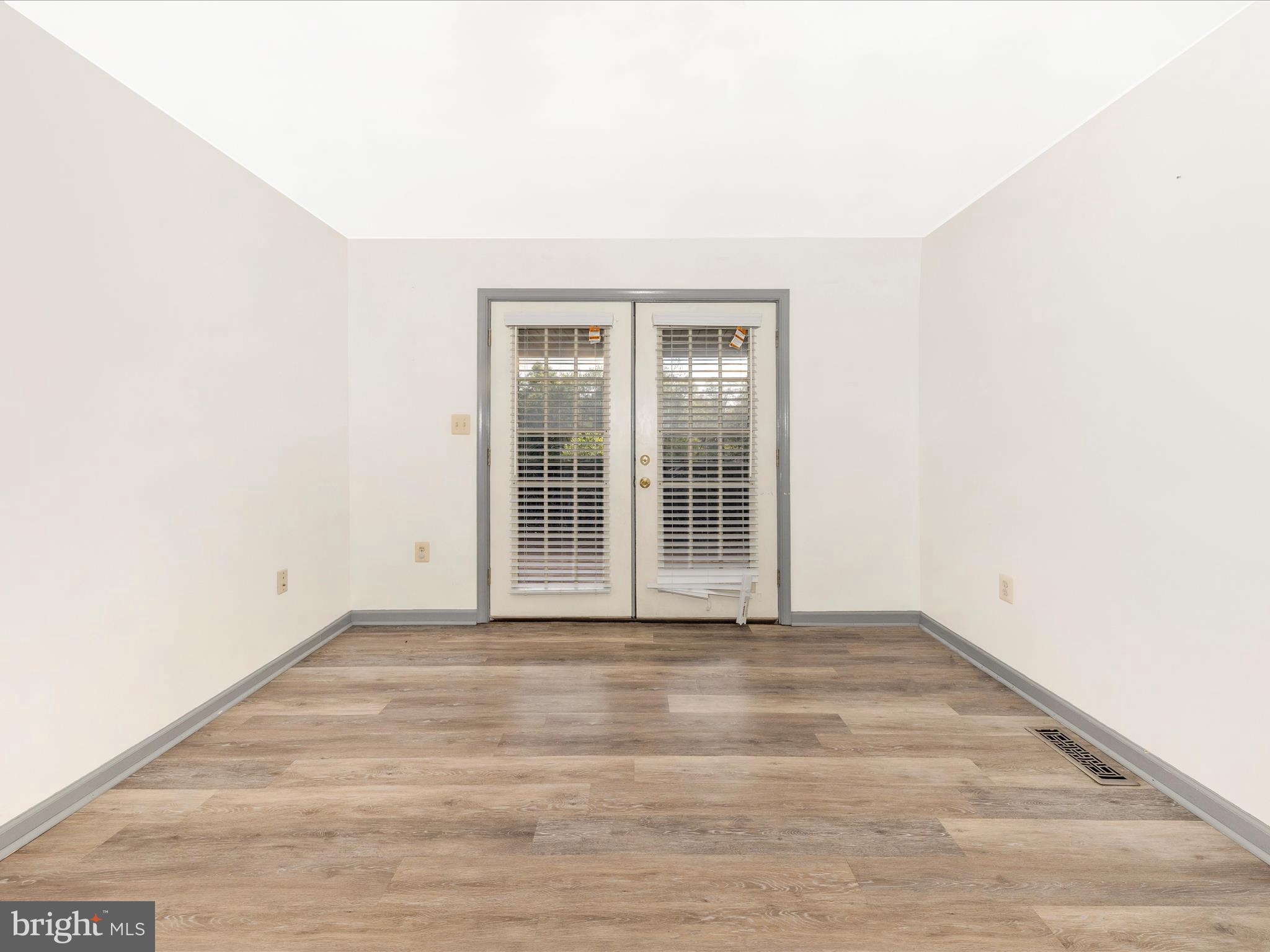 9320 Rocky Ridge Road Rocky Ridge, MD 21778 - Photo 7 of 54 a view of an empty room with wooden floor