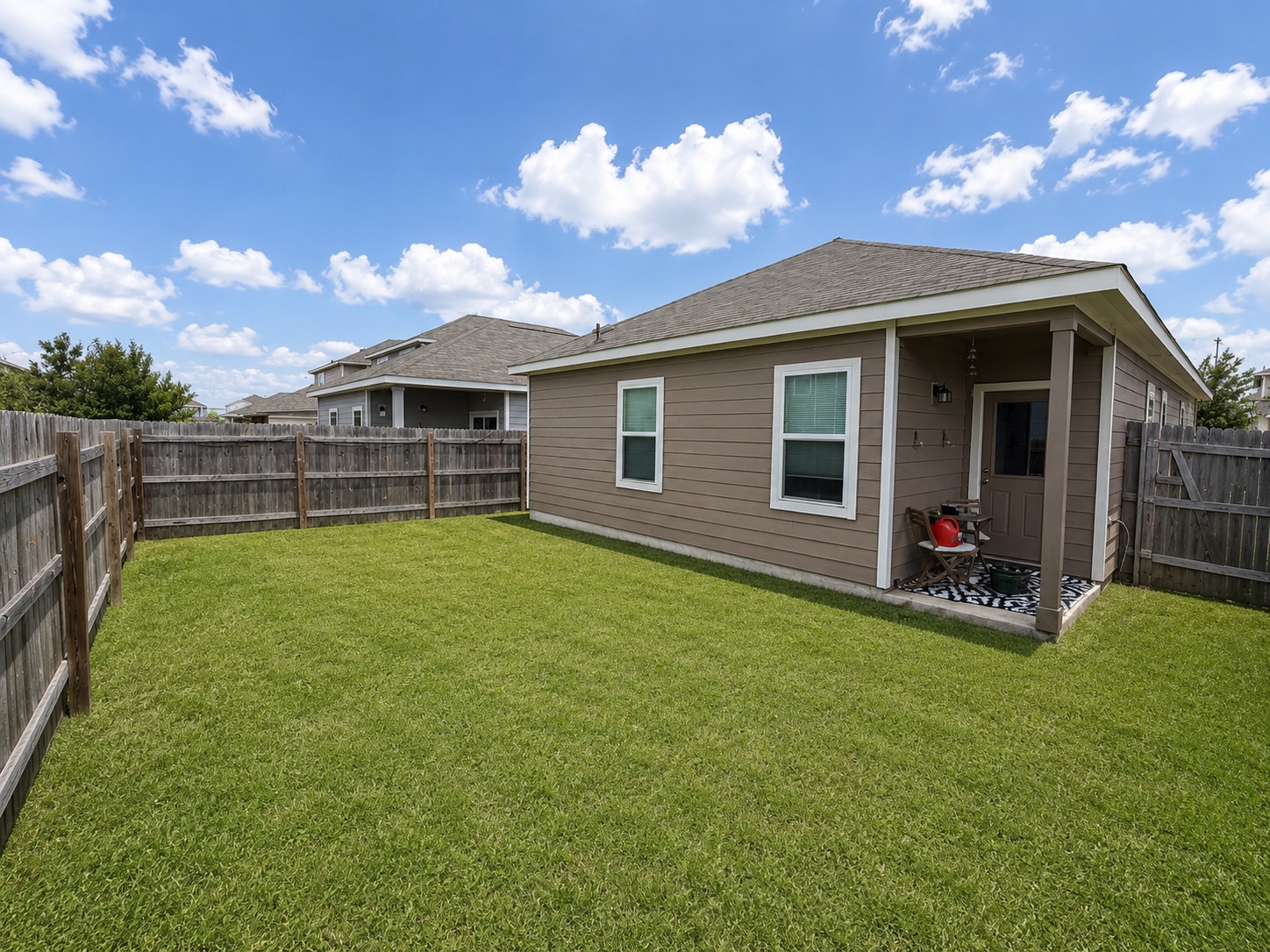 160 Light Timber Road Maxwell, TX 78656 - Photo 10 of 11 A quaint backyard space awaits, complete with a covered patio for outdoor enjoyment.