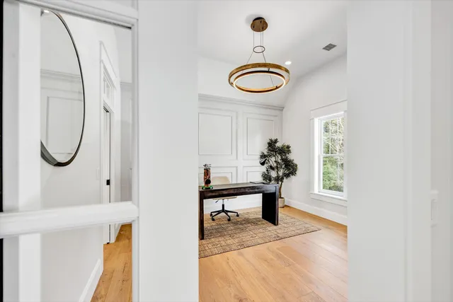 a view of a livingroom with furniture and a window