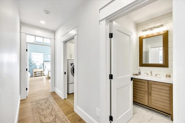 a spacious bedroom with a bed and a dresser