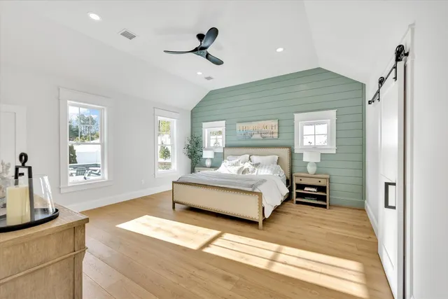 a bedroom with a bed and cabinets