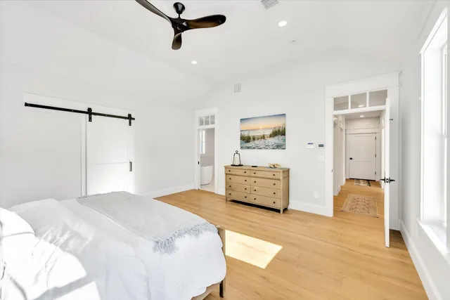 a bedroom with a bed and a dresser