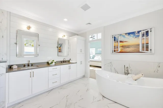 a bathroom with a bathtub and a shower