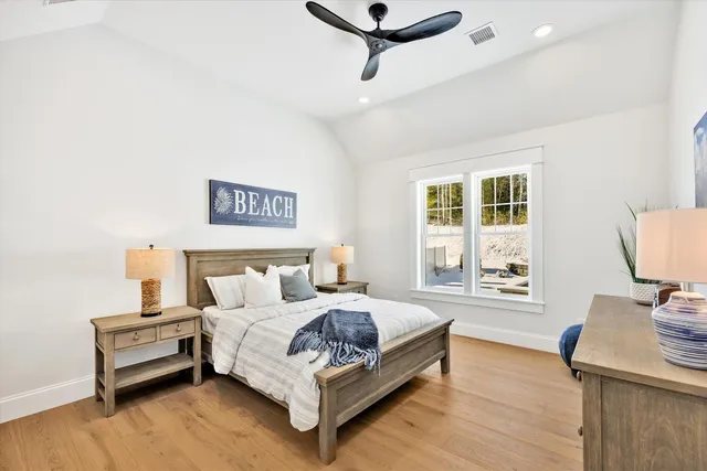 a bedroom with a bed and a dresser