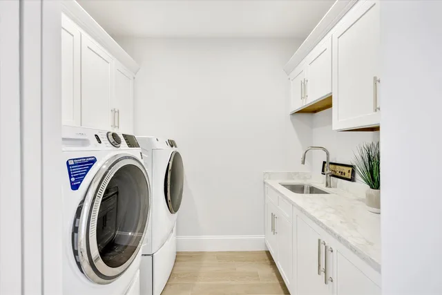 a bathroom with a sink a mirror and a window