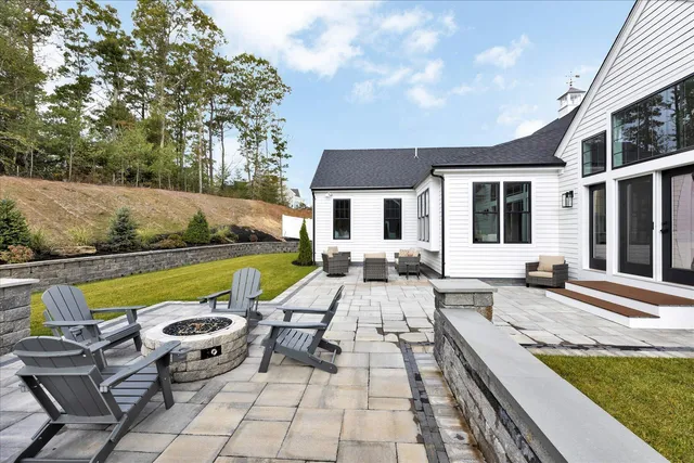 a bathroom with a granite countertop sink mirror and vanity
