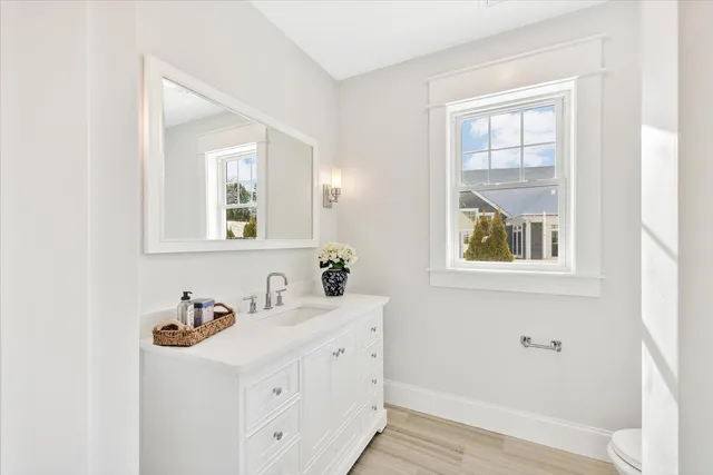 a bedroom with a bed a couch and a flat screen tv