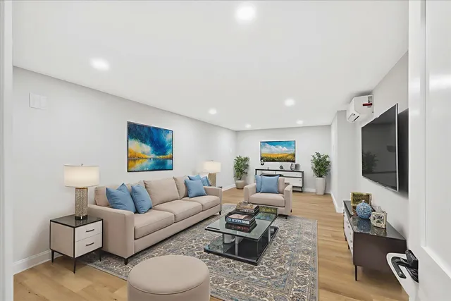 a view of a workspace with furniture and bookshelf