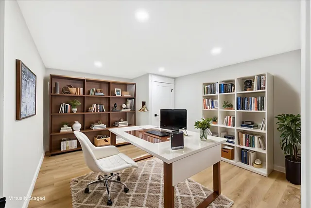 a view of a house with swimming pool and sitting area