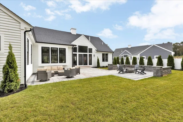 a view of a patio with couches and potted plants