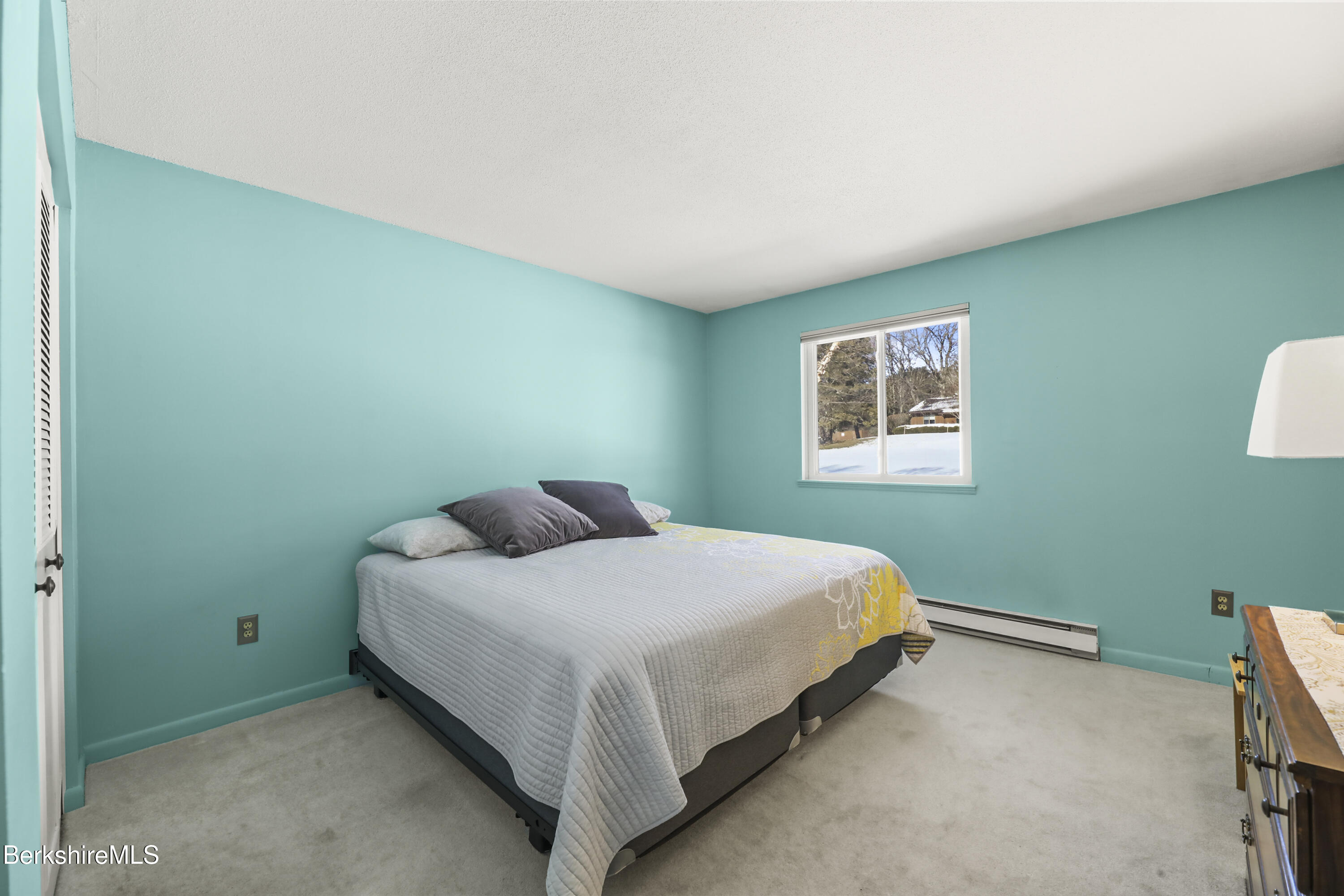 44 Churchill Crest, Unit 44 Pittsfield, MA 01201 - Photo 15 of 25 a bedroom with a bed and a window