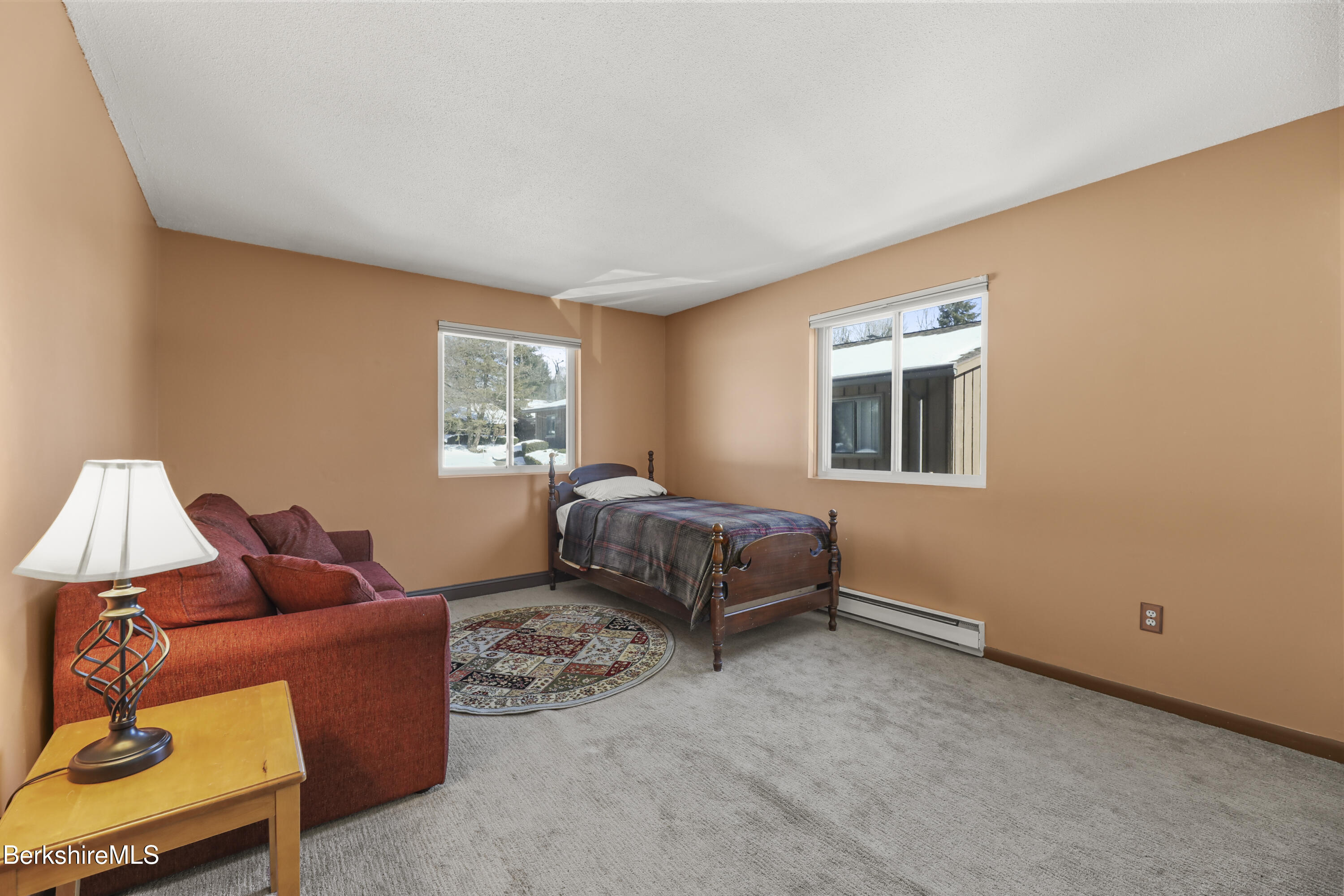 44 Churchill Crest, Unit 44 Pittsfield, MA 01201 - Photo 17 of 25 a bedroom with furniture and a window