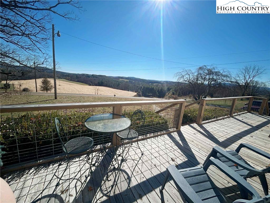 a view of a balcony with chairs